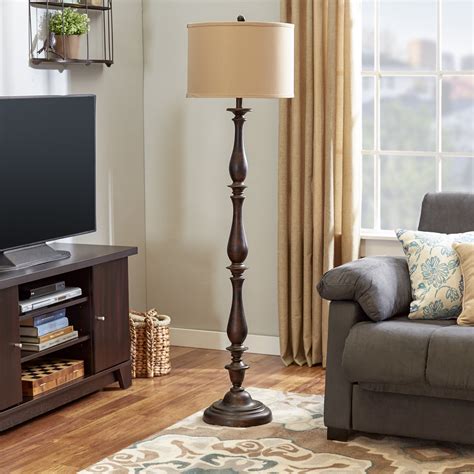 This multi-functional lamp features two amber glass shades attached on the threaded mount- a crowning top shade (compatible with one A19E26 or LED equivalent lightbulb) and a reading light extension (compatible with one 40-watt or LED equivalent lightbulb). . Wayfair floor lamp